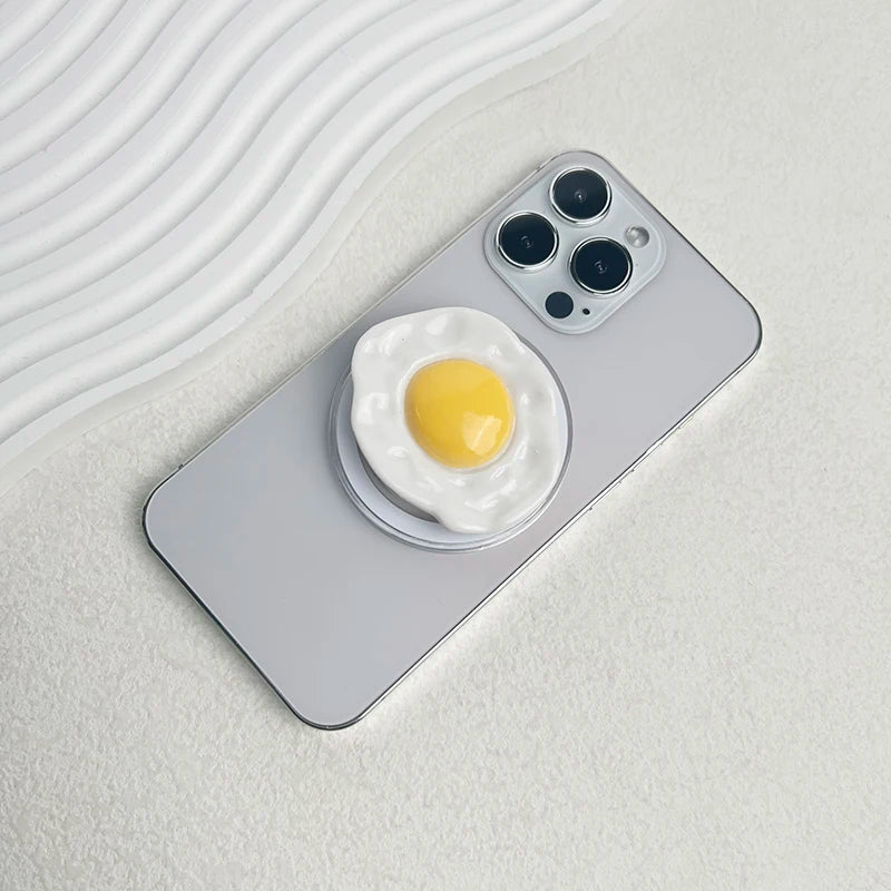 Creative Egg Phone Holder – Foldable Socket Grip & Expanding Stand for iPhone, Samsung, Mac, Magsafe