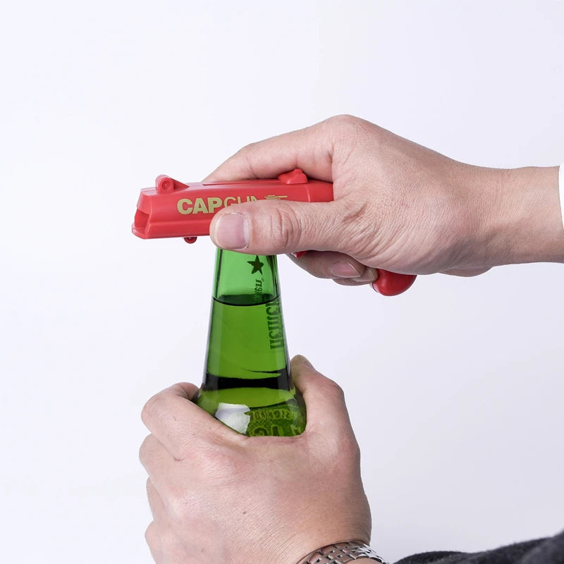 Portable Cap Gun Bottle Opener – Creative Flying Cap Launcher, Gun-Shaped Drink Opener for Beer, Red & Gray