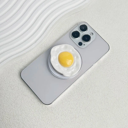 Creative Egg Phone Holder – Foldable Socket Grip & Expanding Stand for iPhone, Samsung, Mac, Magsafe