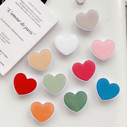 Universal Heart-Shaped Phone Socket Holder: Finger Grip Bracket Support for iPhone 15, 14, 13, Samsung - Pocket Socket Stand