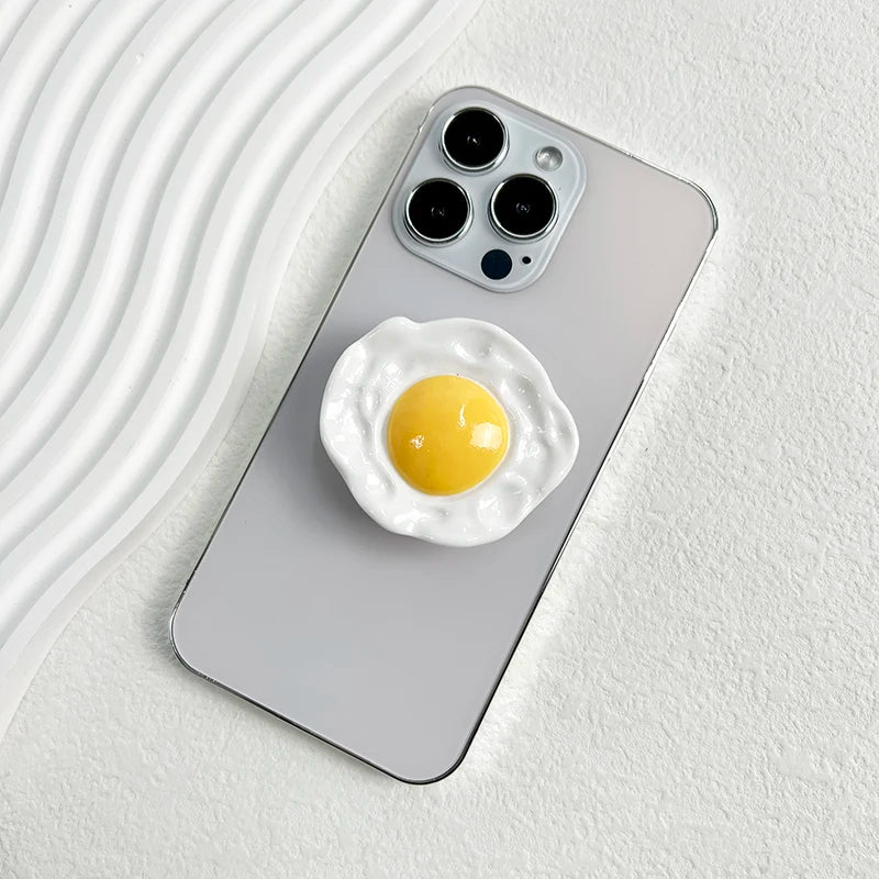 Creative Egg Phone Holder – Foldable Socket Grip & Expanding Stand for iPhone, Samsung, Mac, Magsafe
