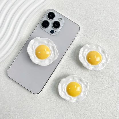 Creative Egg Phone Holder – Foldable Socket Grip & Expanding Stand for iPhone, Samsung, Mac, Magsafe