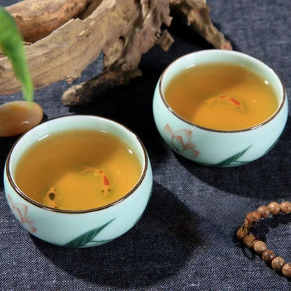 Traditional Celadon Hand-Painted Teacup — 80ml Ceramic Lotus & Bamboo Double-Fish Chinese Tea Cup